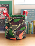Panier rond Gága M en tissu wax africain vert graphique et pêche, vue de face