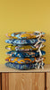 galettes de chaises tolix A en tissu jaune et bleu